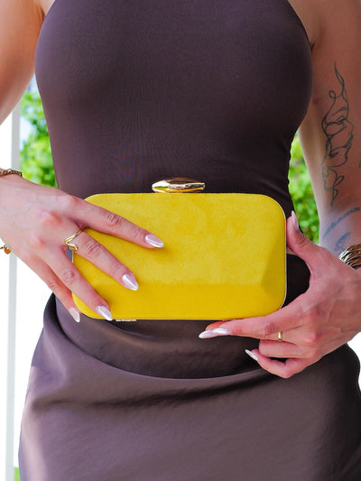 Yellow horizontal oval clutch
