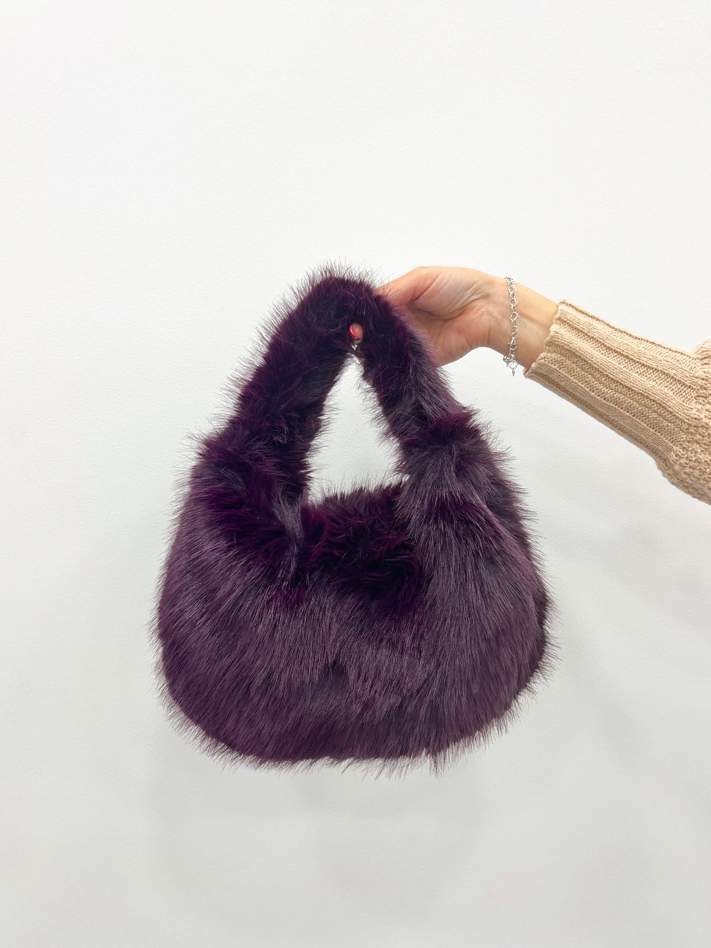 Purple fur handbag