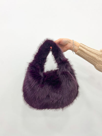 Purple fur handbag