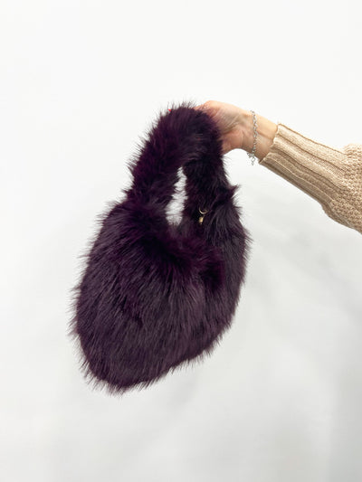 Purple fur handbag