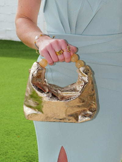 Gold metallic handle clutch