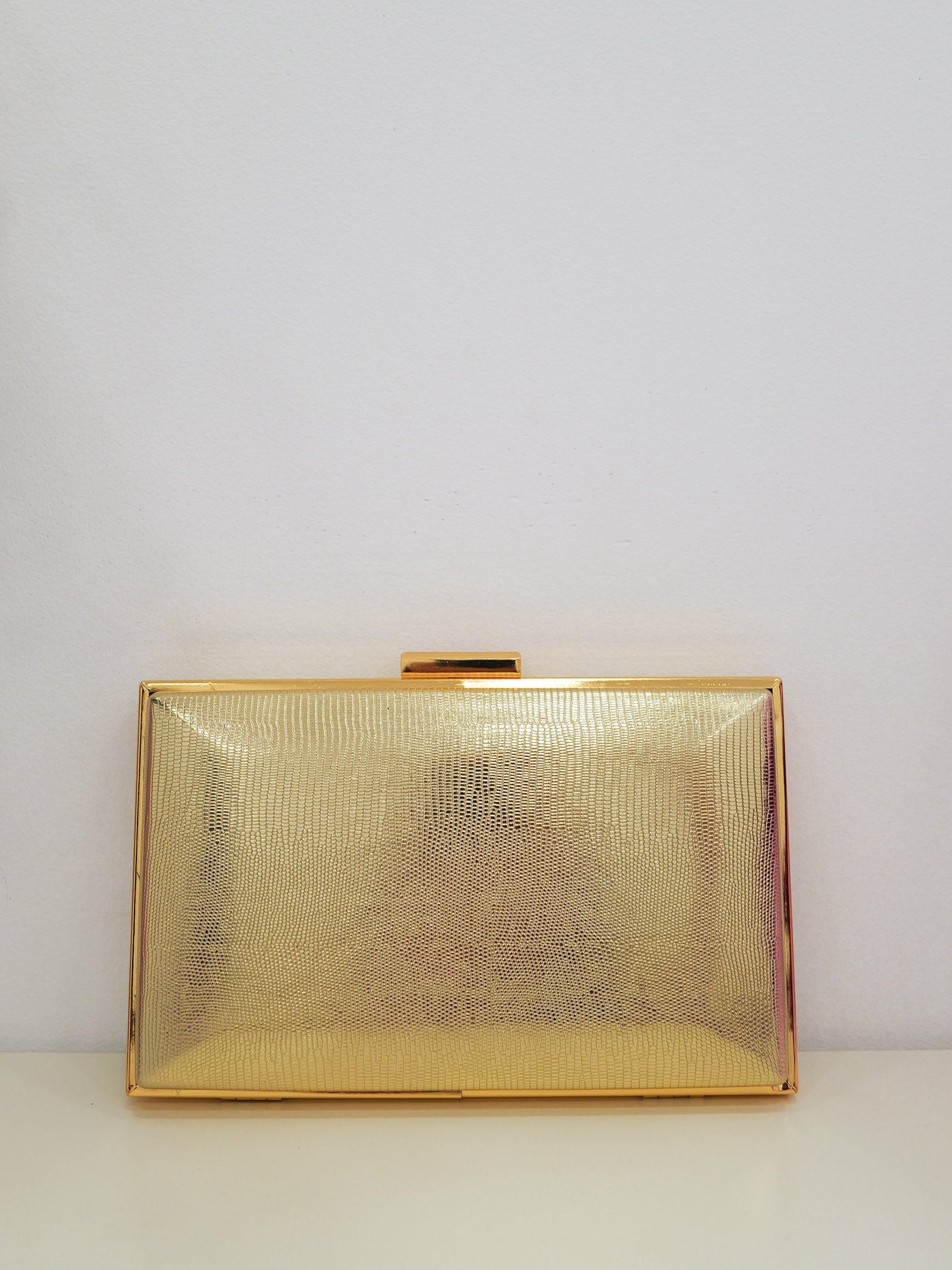 Golden textured clutch
