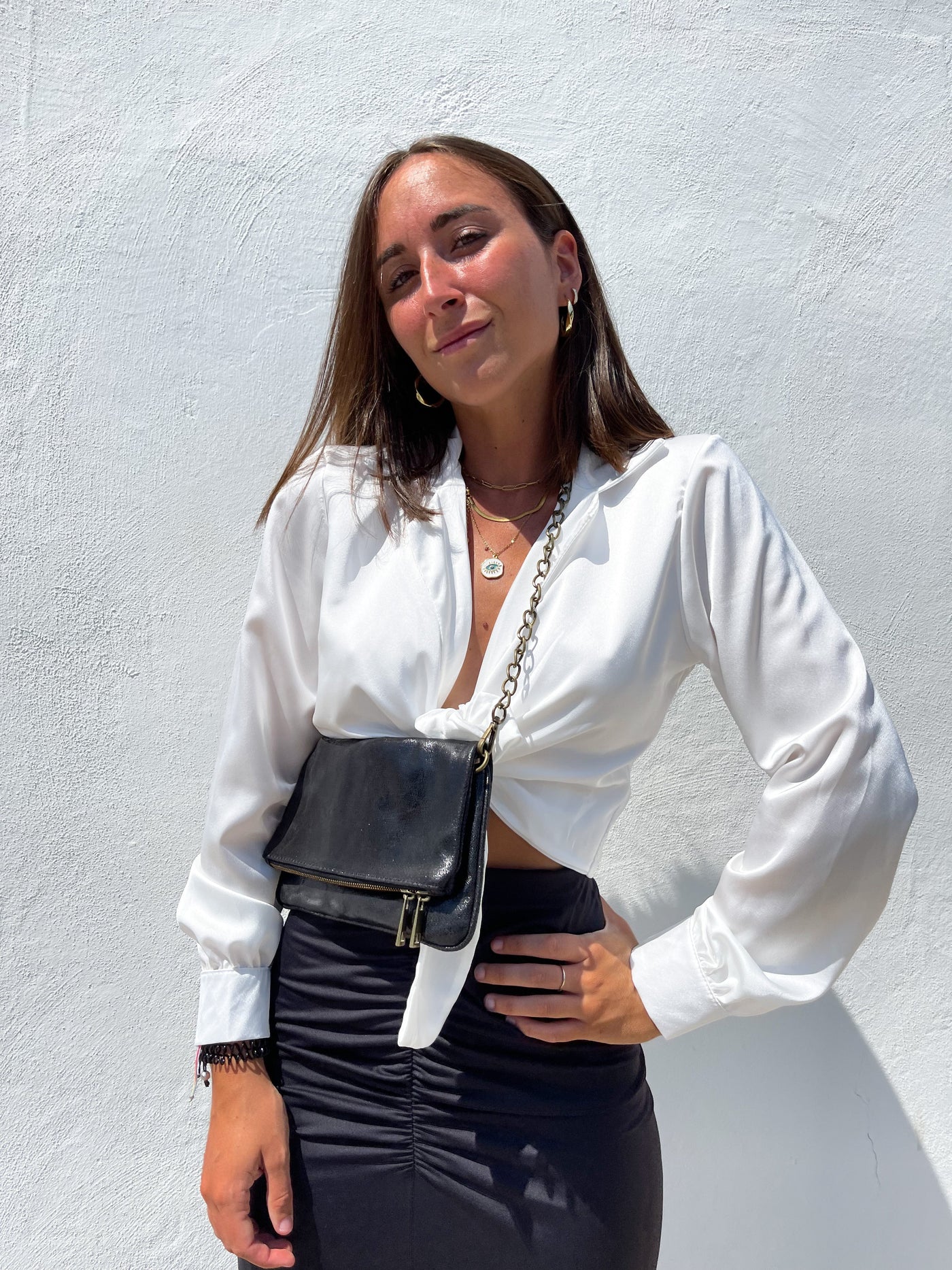 Black leather bag with shiny chains